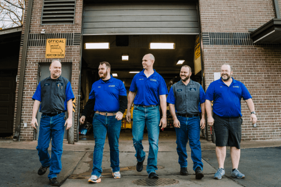 This picture is a real picture of the team of mechanics at Otto Service in Kansas City