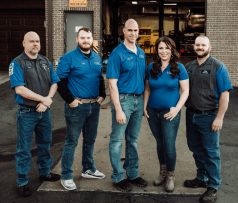 Should You Hire A Professional Photographer for Your Auto Repair Shop with Tony Romain of Shop Marketing Pros, image of Otto Service of KC professional photos of owners and staff outside of their shop in Kansas City, MO