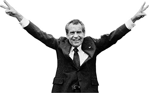 Image of Richard Nixon with arms raised giving the peace sign with both hands